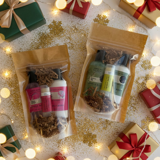 Two packages of natural skincare products with herbs on a light background