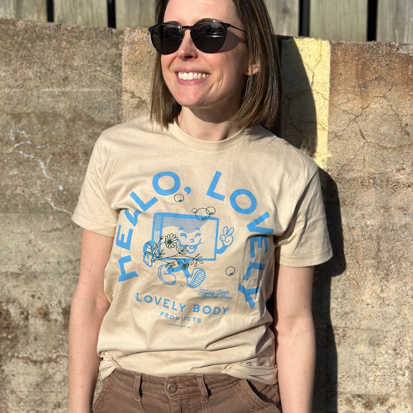 Woman wearing cream coloured t-shirt 