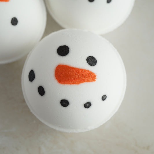 Round bath bomb with hand painted snowman face